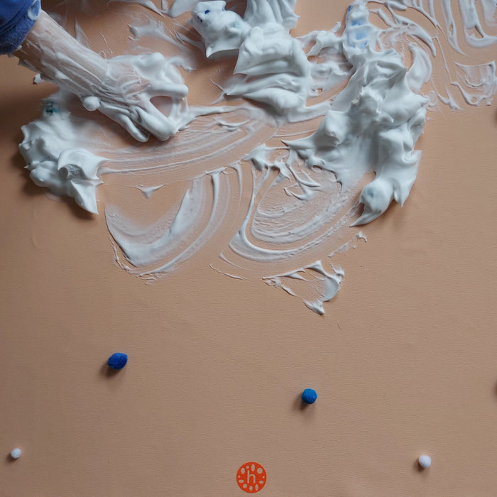 Shaving cream sensory play with arctic animals on blush pink Huske mat
