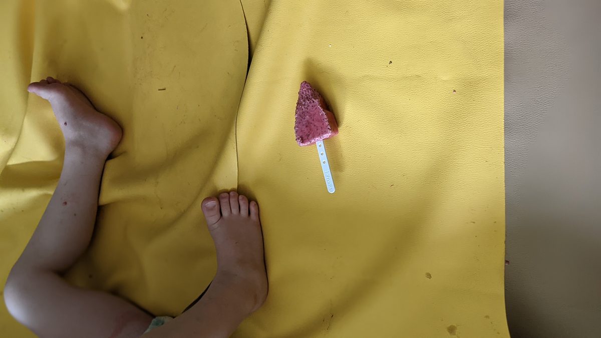 Dropped ice cream on a yellow Studio Huske play mat, easy to wipe clean