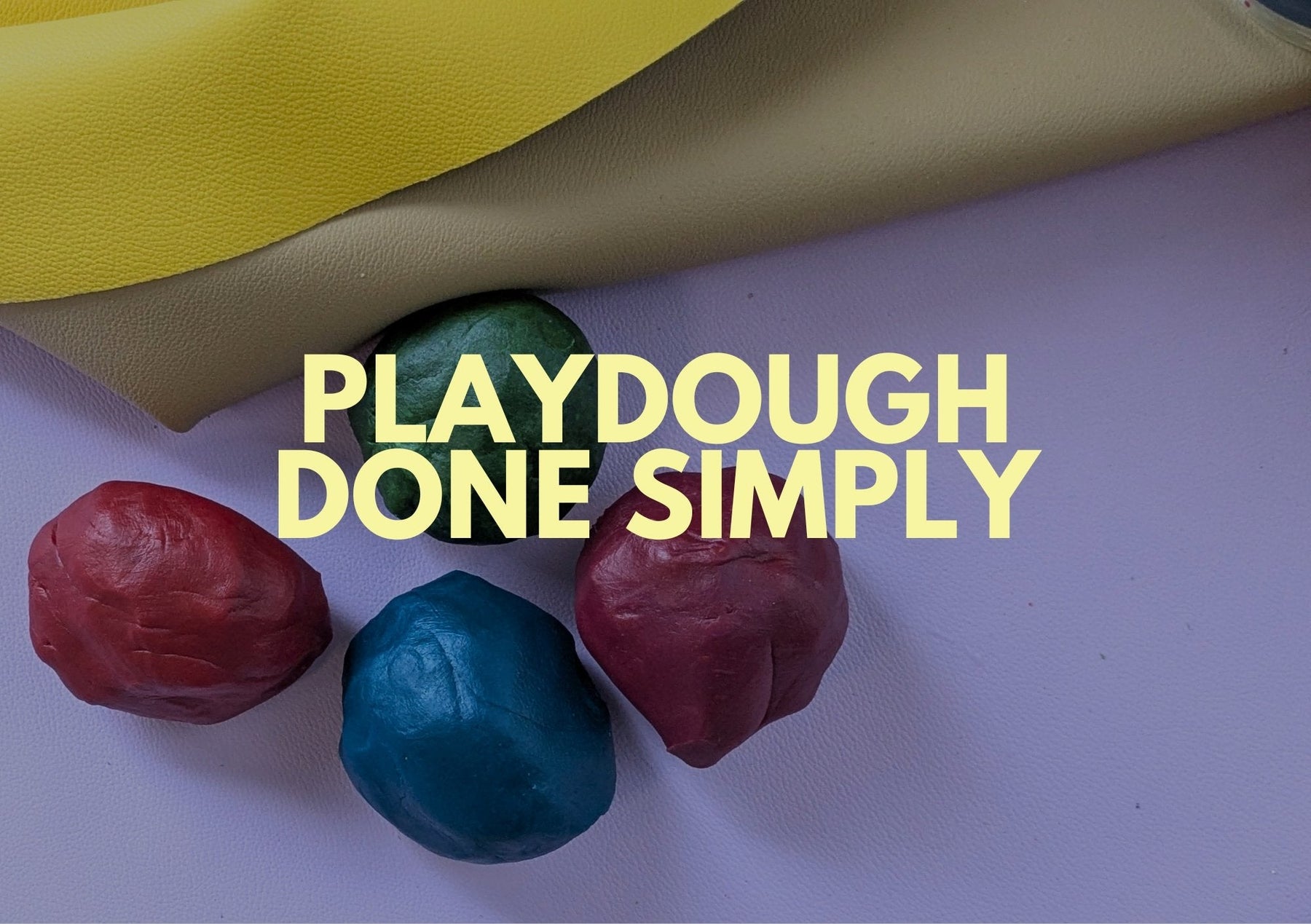 Colorful playdough on a surface, showcasing sensory play at home for creativity and exploration.