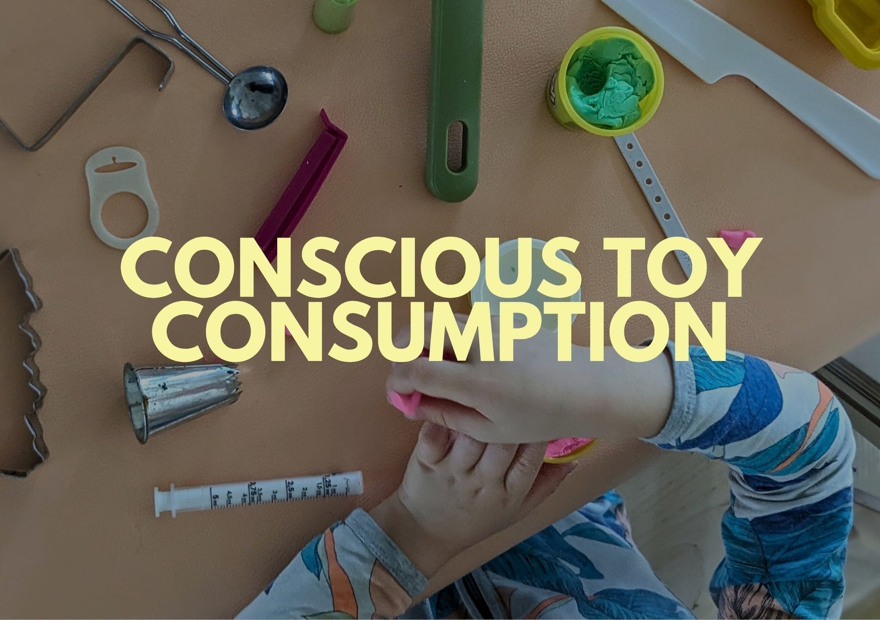 Child engaging with eco-friendly minimalist parenting toys for conscious toy consumption.