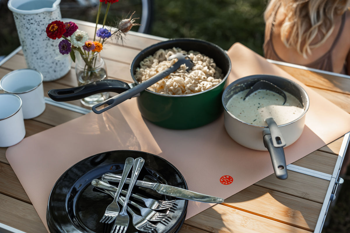 Studio Huske play mat — wider view of camping dinner with blush mat as table cover