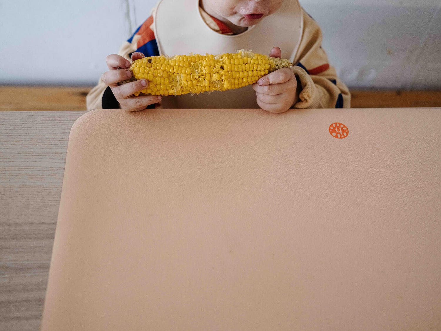 Wriggle silicone mat under a baby during weaning