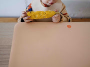 Wriggle silicone mat under a baby during weaning
