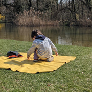 Explore Yellow/Mocca large round silicone play mat, boy yellow mat pond bank bare trees early spring