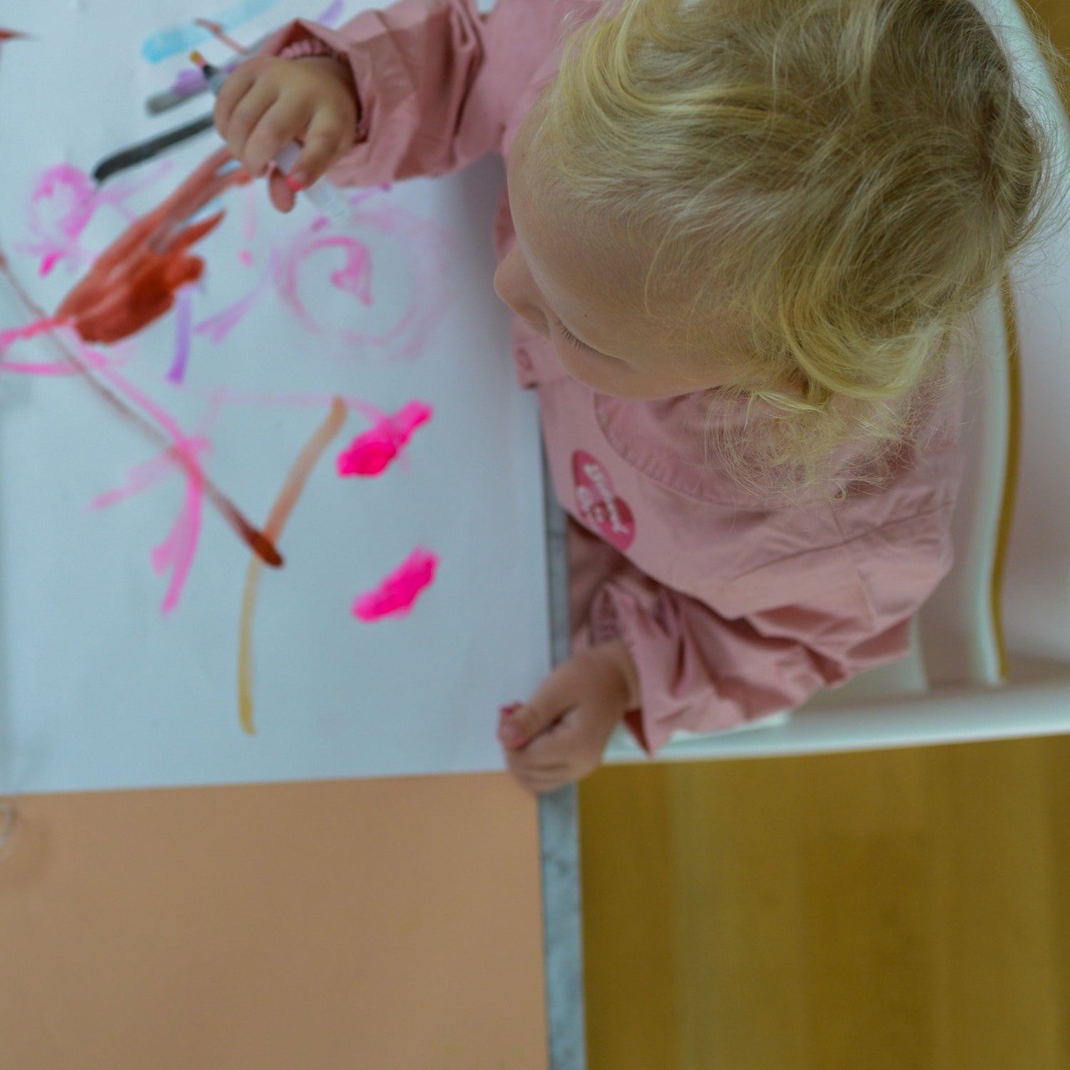 Roam Square Peach/Green silicone craft mat, toddler painting at the high chair