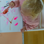 Roam Square Peach/Green silicone craft mat, toddler painting at the high chair