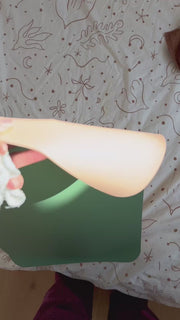 Studio Huske changing mat: 15 second video of the peach mat unfolded, used for a nappy change and packed away