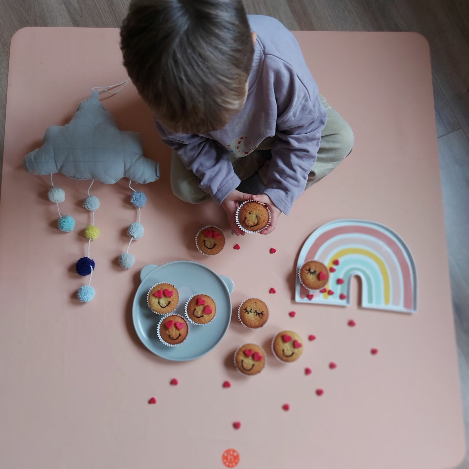 Roam Square Peach/Green silicone craft mat, birthday cupcakes and garlands overhead