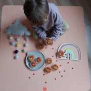 Roam Square Peach/Green silicone craft mat, birthday cupcakes and garlands overhead