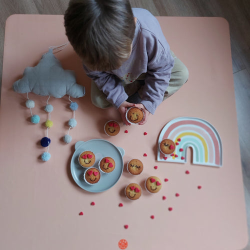Roam Square Peach/Green silicone craft mat, birthday cupcakes and garlands overhead