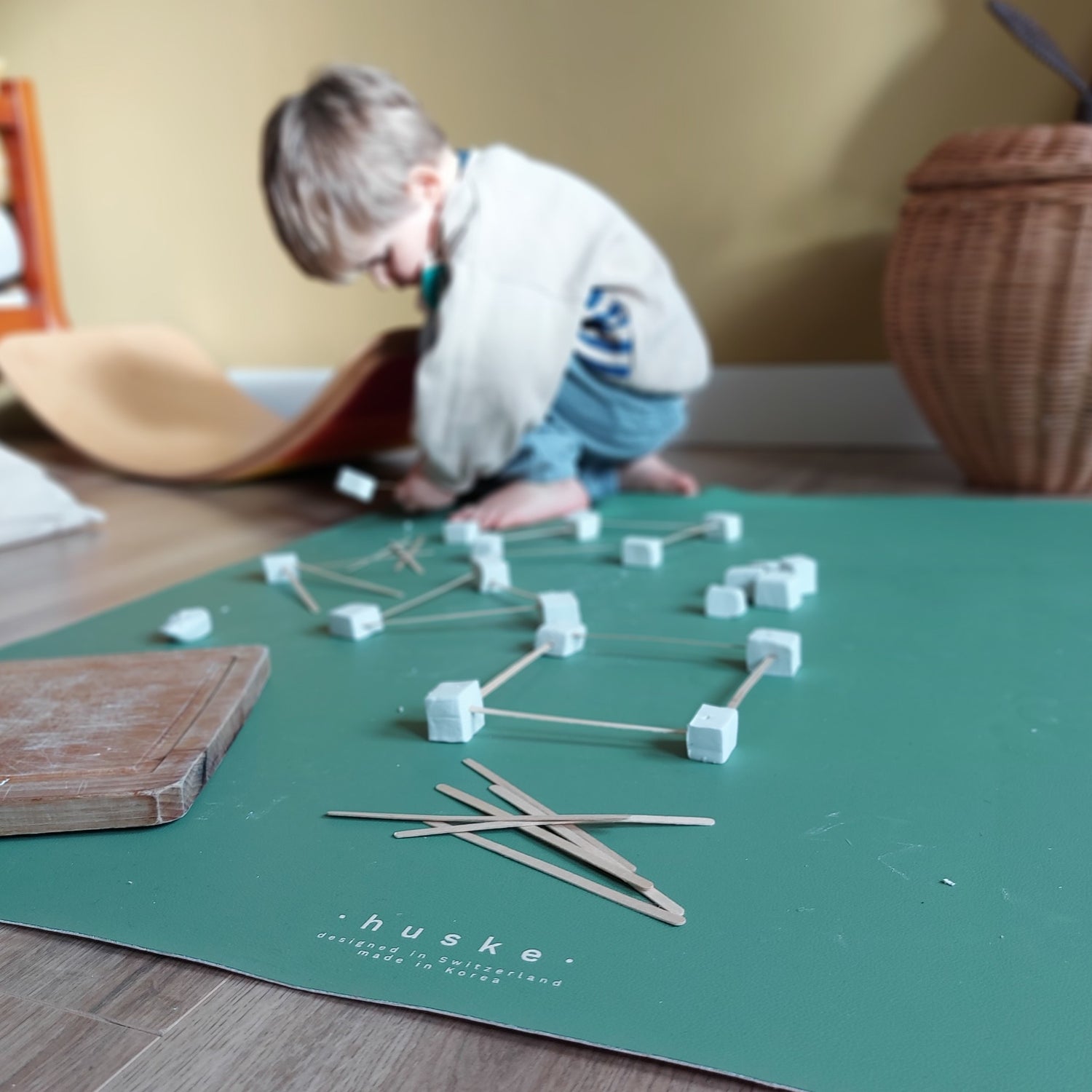 Roam Square Sage Green face silicone craft mat, marshmallow and stick building on the sage green face