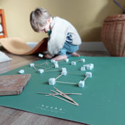 Roam Square Sage Green face silicone craft mat, marshmallow and stick building on the sage green face