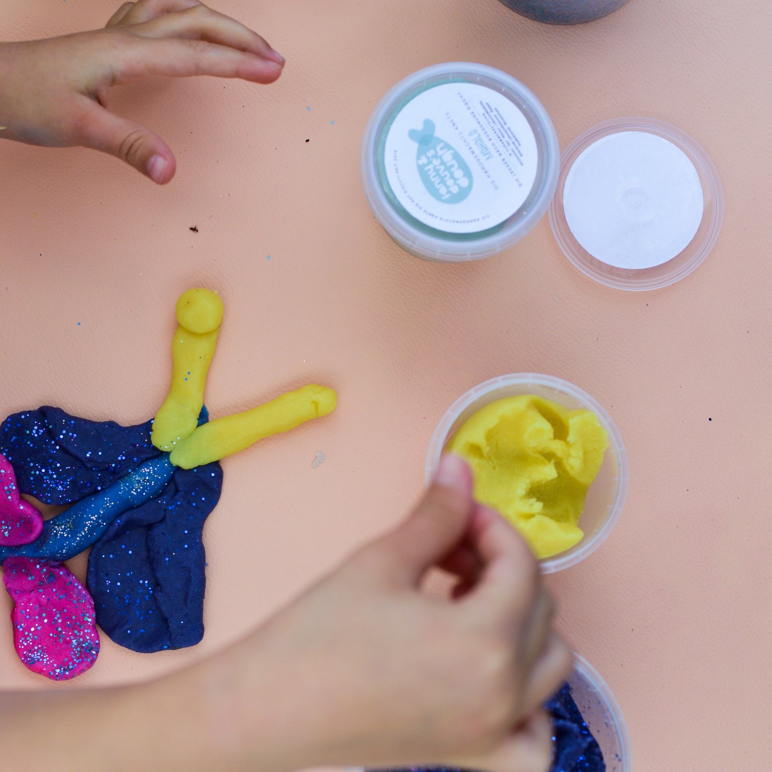 Roam Square Peach/Green silicone craft mat, small hands sculpting playdough