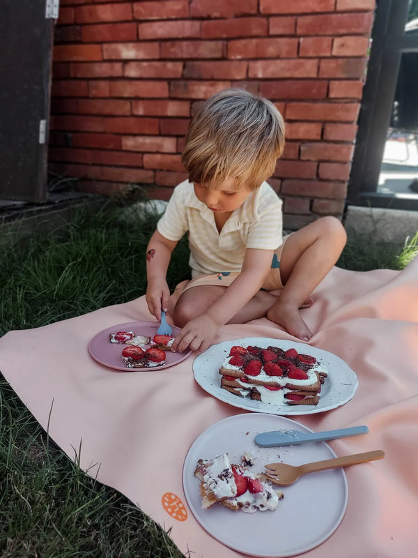 Child on silicone leather play mat
