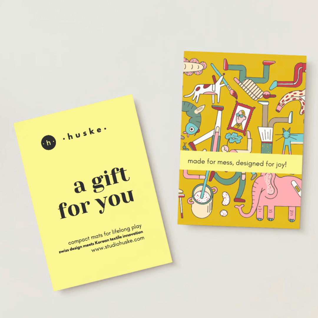 Studio Huske digital gift card in stone and gold, showing denominations from CHF 50 to CHF 200
