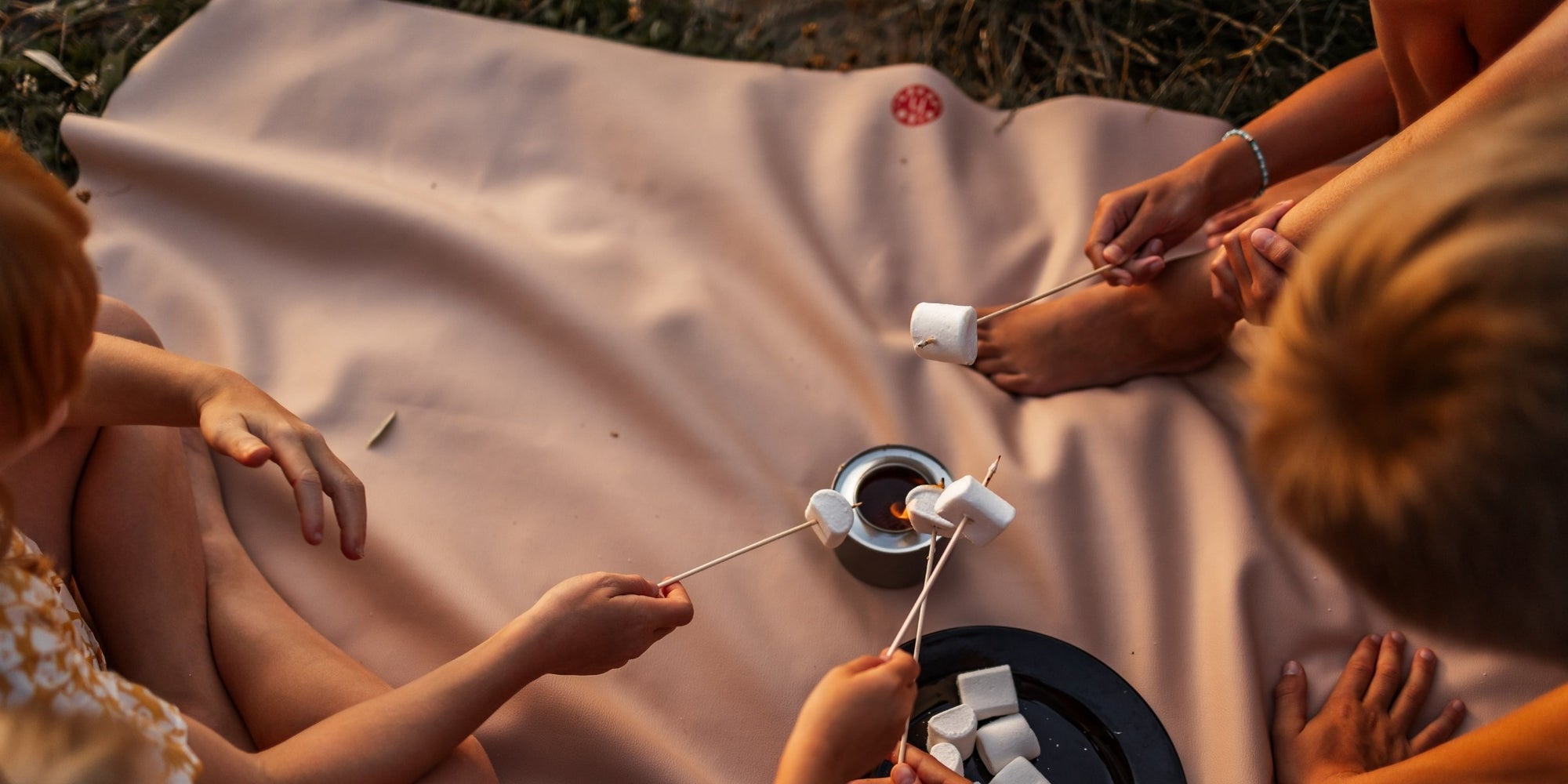 Studio Huske mat on ground beside camper van with morning light and fold lines.