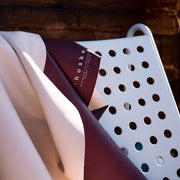 Explore Beige/Wine large round silicone play mat, real silicone leather texture with the wine face folded over