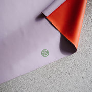 Wriggle silicone changing mat and placemat in Lilac/Red, real silicone leather texture with the reversible second colour