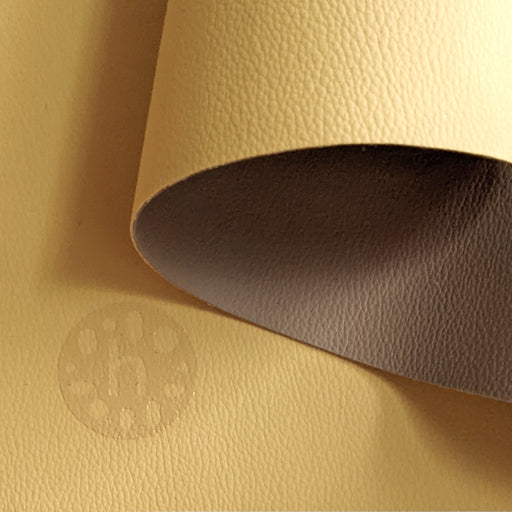 Wriggle silicone changing mat and placemat in Yellow/Mocca, real silicone leather texture with the reversible second