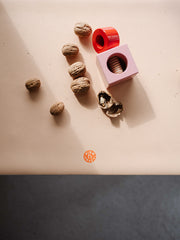 Waterproof silicone leather changing mat with toys and walnuts, ideal for play and activities.