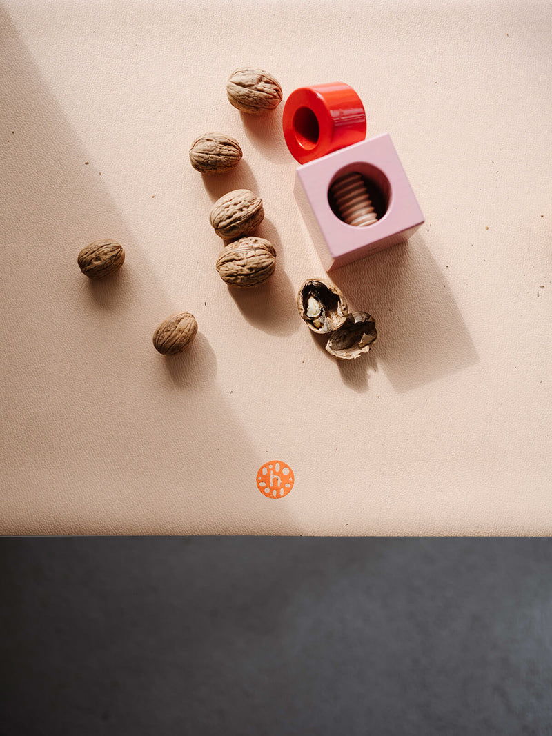 Waterproof silicone leather changing mat with toys and walnuts, ideal for play and activities.