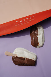 Vegan leather play mat featuring colorful ice cream treats on a soft surface.