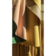 Silicone leather play mat in soft, minimal colors hanging elegantly, ideal for family spaces.