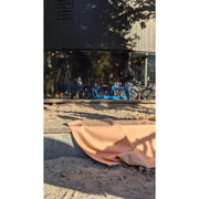 Silicone leather play mat displayed in a bright outdoor setting, blending comfort and style for family play.