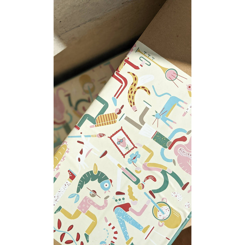 Colorful patterned wrapping paper featuring playful, abstract characters and designs, ideal for creative gift presentations.