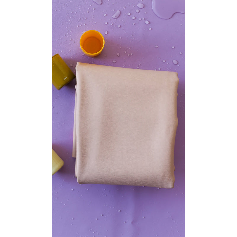 Extra large waterproof silicone mat on a purple surface, ideal for family picnics and play.
