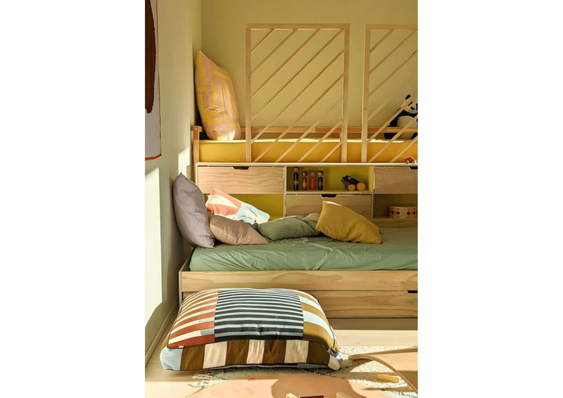 Ikea Kura bed hack DIY plans featuring a cozy bunk bed with colorful pillows and bedding.