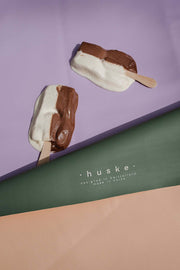 Large round waterproof play mat with ice cream pops on a pastel background, showcasing its wipe-clean surface.