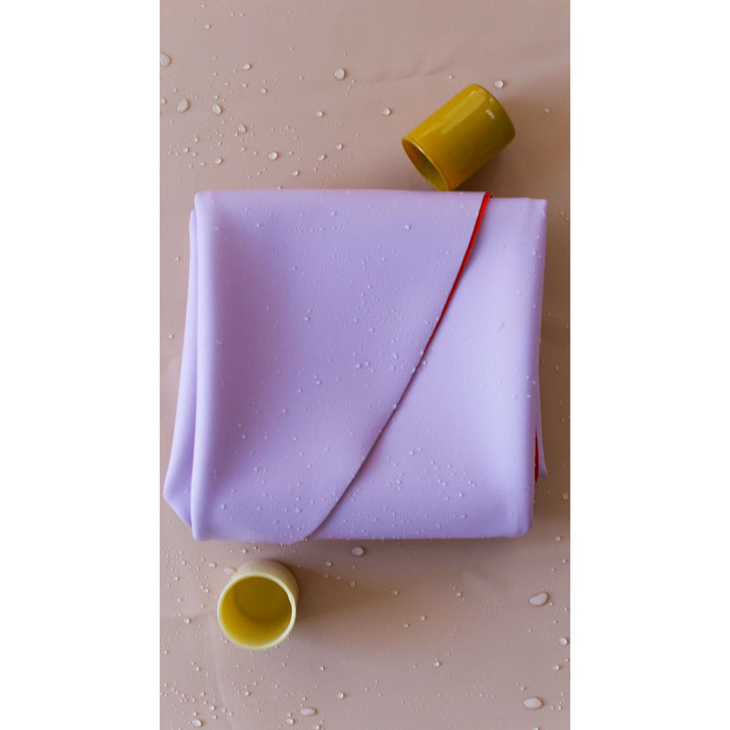 Large round waterproof play mat displayed with playful yellow cups on a water-resistant surface.