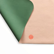 Waterproof silicone leather changing mat showing a green and pink surface design.
