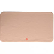 Waterproof silicone leather changing mat, Wriggle Mat (S) in a soft peach color, perfect for changing and play.