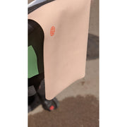 Waterproof silicone leather changing mat shown draped on a stroller in a natural outdoor setting.