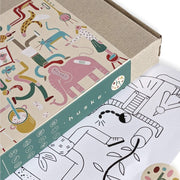 Colorful packaging design of the Wriggle Mat with playful illustrations and the Studio Huske logo.