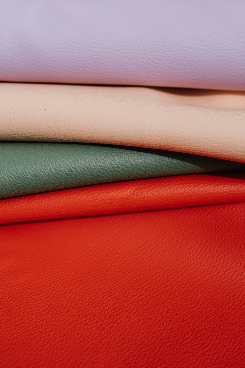 Large round waterproof play mat materials in soft leather effect silicone, showcasing pastel colors.