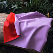Waterproof square play mat for children, Roam Mat in purple and red, showcasing a soft and tactile surface.